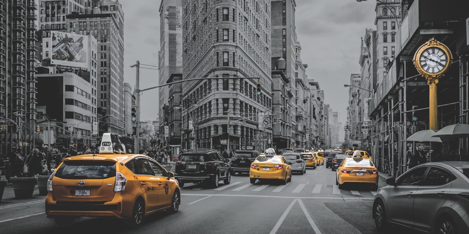 This image by Xerox uses clear dry ink to make the yellow on the taxis stand out.